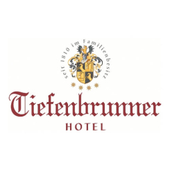 Tiefenbrunner Hotel Logo: Seit 1810 in Familienbesitz mit Wappen, Luxusunterkünfte-Branding.